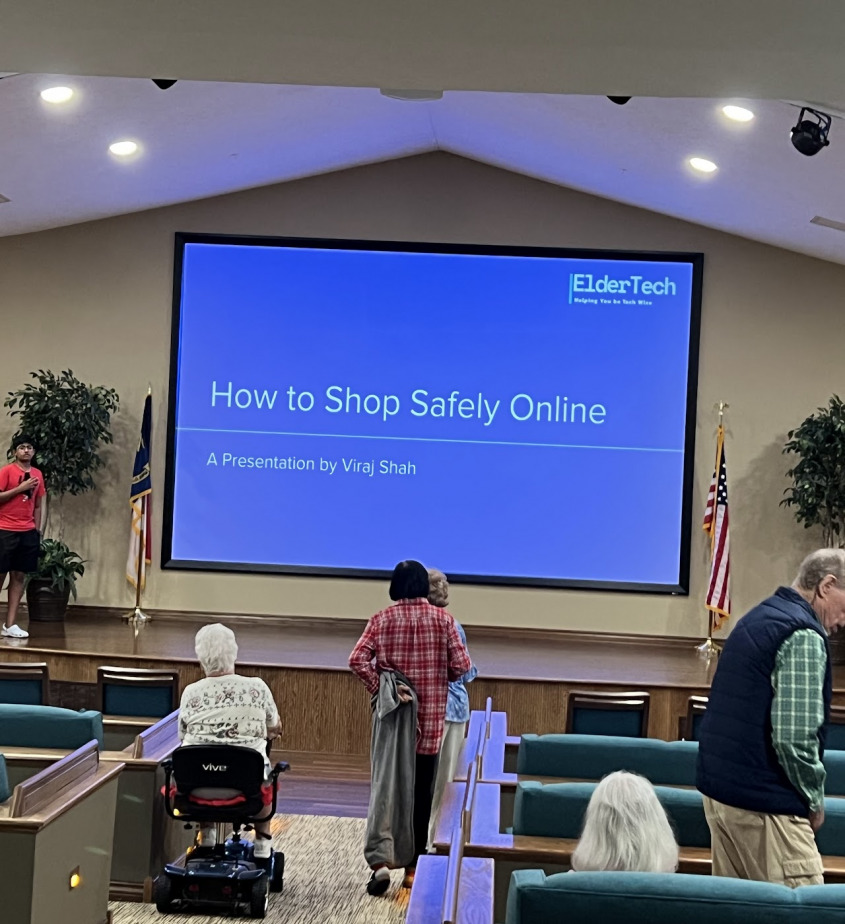 A presentation titled How to Shop Safely Online in front of an audience of seniors